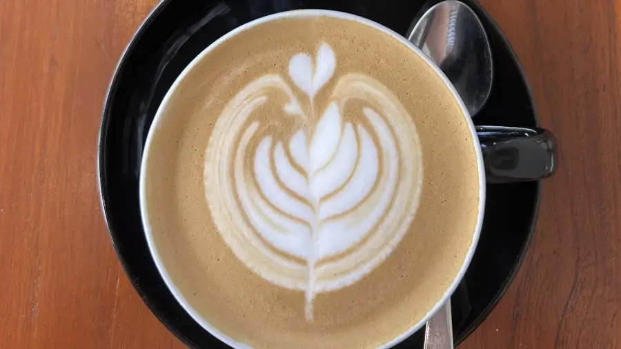 A coffee with rosetta latte art at Break Point Coffee in Bingin