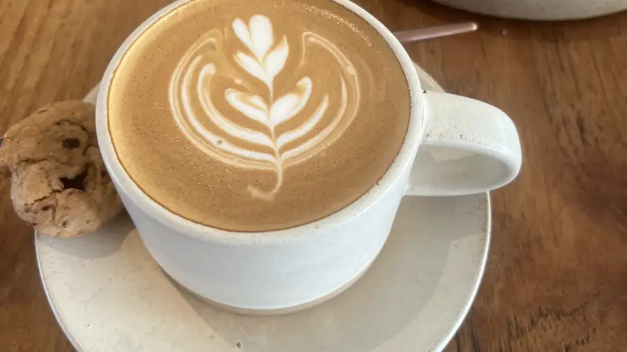 A coffee with rosetta latte art at The Loft in Uluwatu