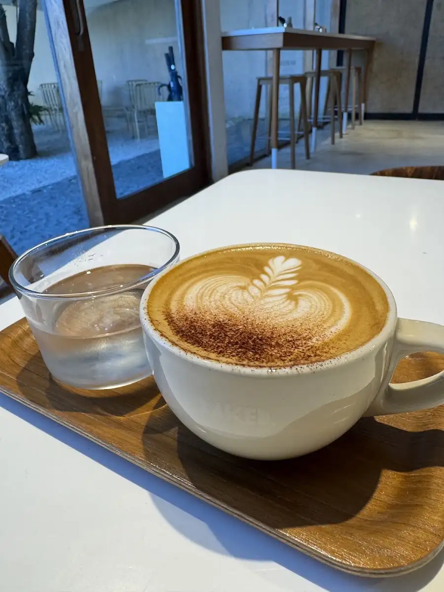 A coffee with latte art at BAKED. Uluwatu