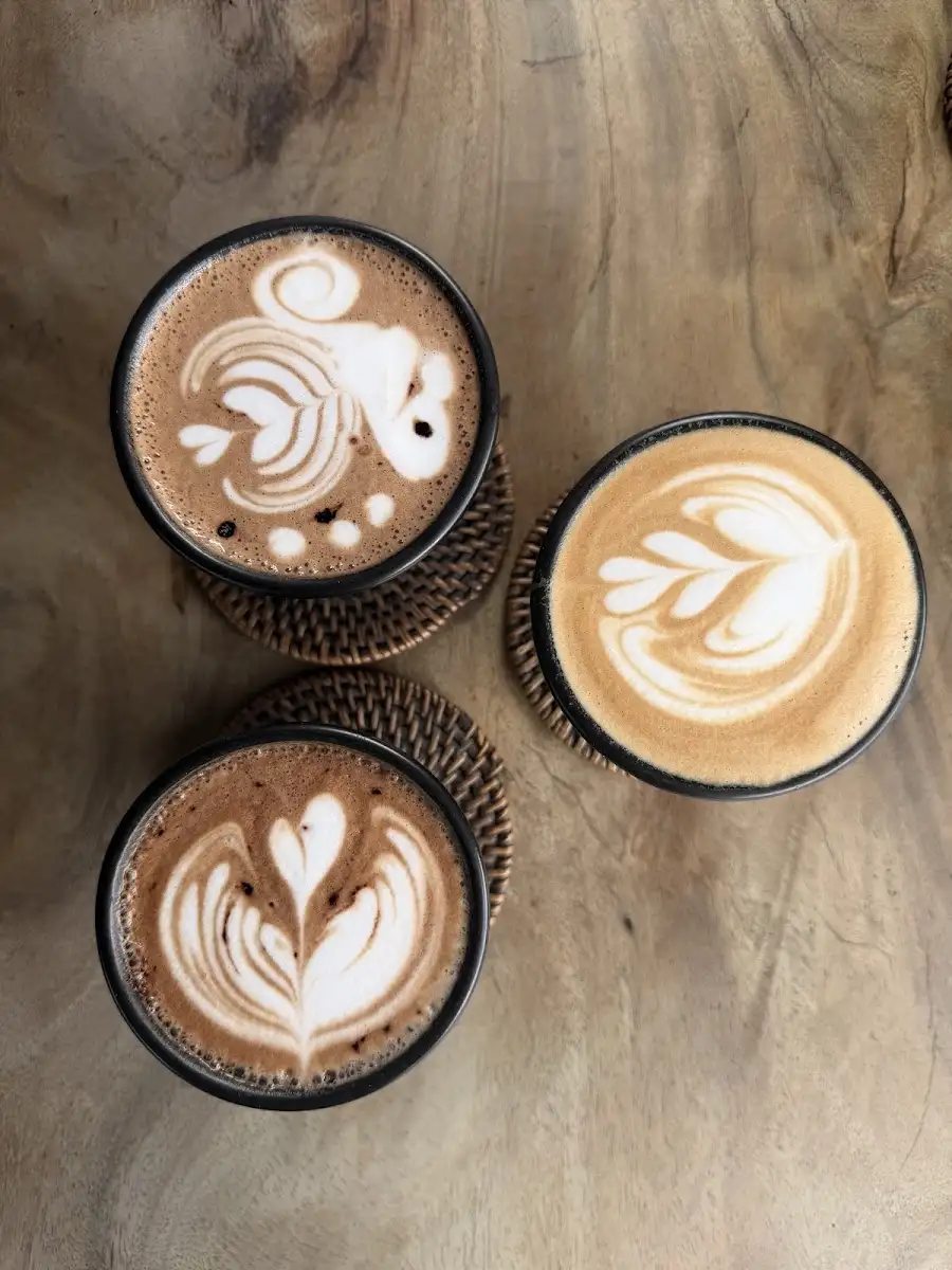 Three coffees with latte art at Suburbia Cafe in Ungasan